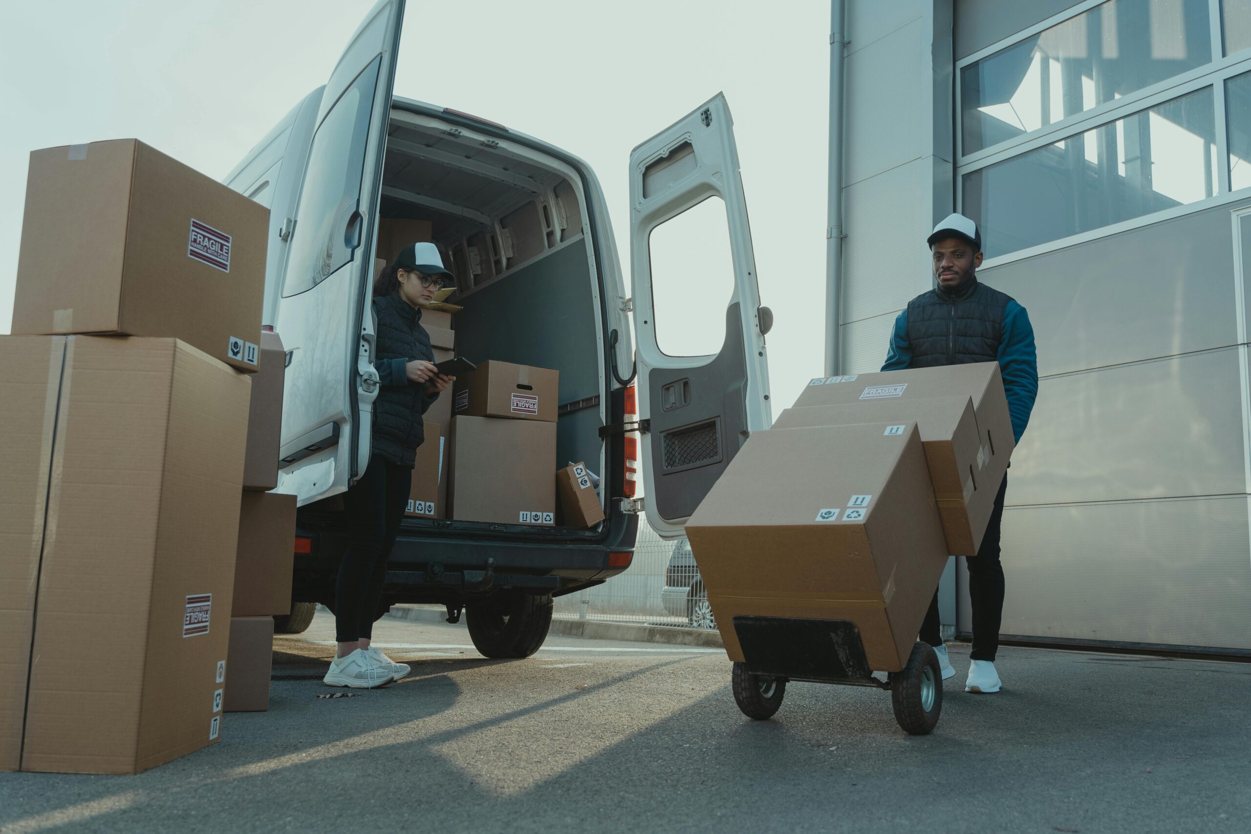 man moving boxes from a van