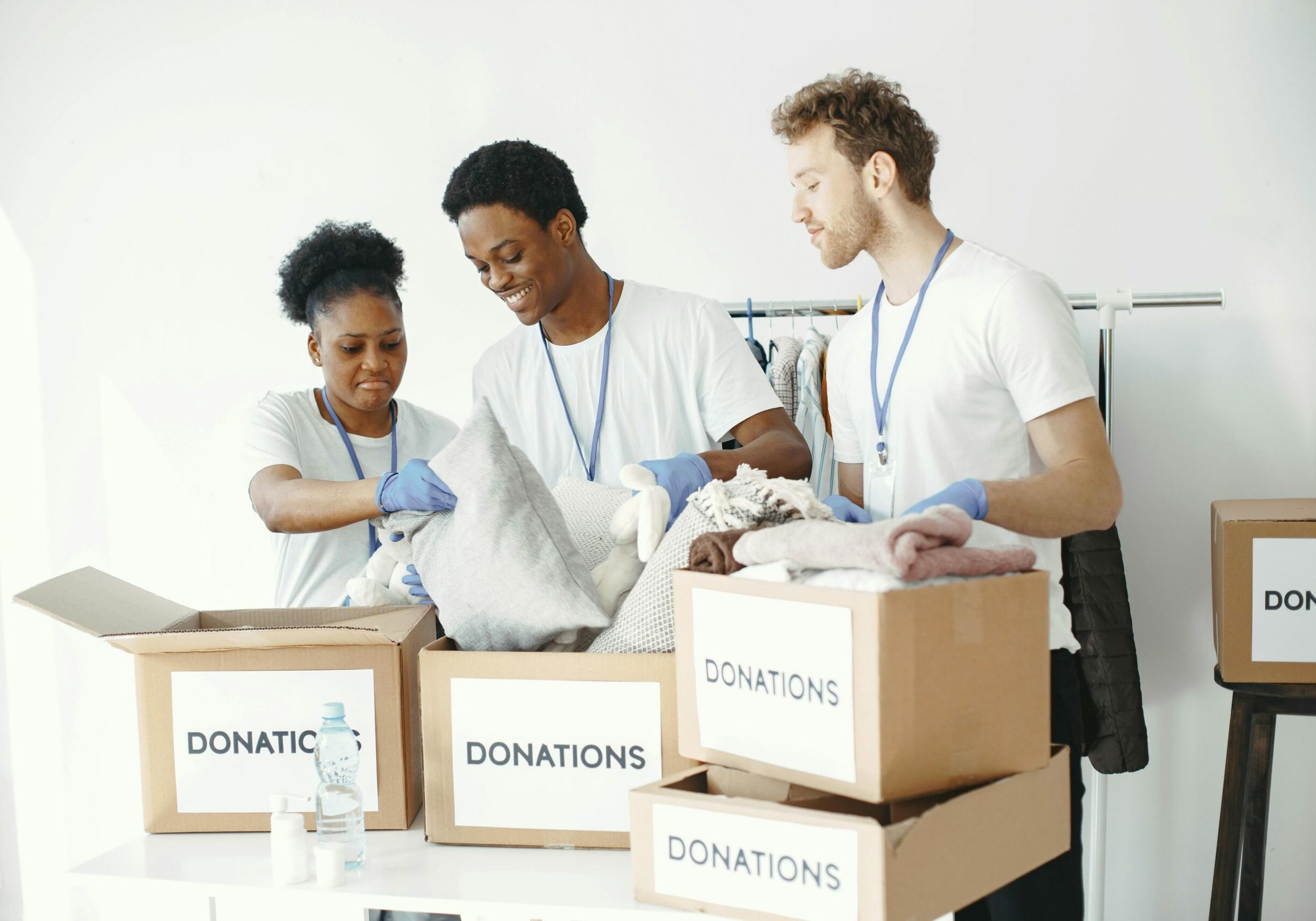 Group of volunteers looking through donations